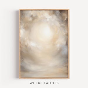 May include: A framed abstract art print with a light-filled, ethereal design. The artwork features a soft, swirling composition of beige, cream, and light brown hues, creating a sense of depth and movement. The text "WHERE FAITH IS" is at the bottom.