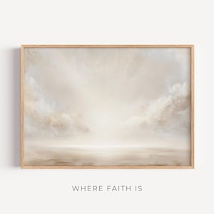 May include: A framed art print displaying a tranquil landscape. The artwork uses a soft, muted palette of beige, cream, and light brown, showing a cloudy sky and a calm, reflective surface. The text "WHERE FAITH IS" is at the bottom of the print.