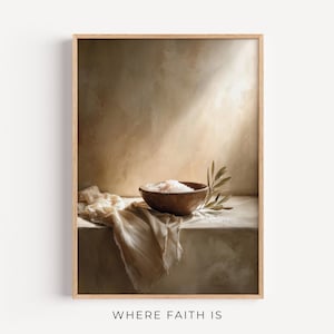 May include: A framed art print featuring a still life composition. A wooden bowl filled with salt sits on a draped cloth, accompanied by an olive branch. The background is a warm, neutral tone with a beam of light. The text "WHERE FAITH IS" is at the bottom.
