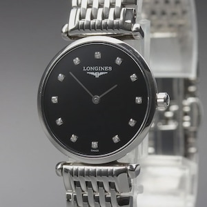 May include: A silver-toned analogue wristwatch featuring a round black dial with diamond hour markers. The watch has a polished stainless steel link bracelet and displays the Longines brand name and logo in white text at the top of the dial.