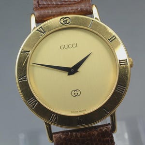 GUCCI 3000 M 腕時計 ウォッチ クォーツ ロゴ ローマン ゴールド色 GUCCI Quartz Watch 3000M Gold 33mm Vintage, New Battery, Unisex | eBay