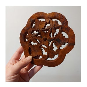 Vintage Indian carved wooded trivet in brown - round footed trivet - floral leaf design - travelled eclectic