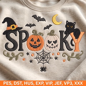 May include: A beige sweatshirt featuring an embroidered design with the word SPOOKY. The design includes a black witch hat, bats, a yellow crescent moon, a black cat, an orange jack-o'-lantern, a white pumpkin, and a spider web with a spider.