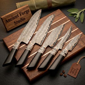 May include: A set of five kitchen knives with hammered metal blades, copper-colored bolsters, and black handles with marbled accents. The knives are arranged on a dark wooden cutting board featuring a copper mesh inlay and the text Ancient Forge Studio.