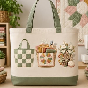 May include: Cream-colored tote bag with green accents, featuring a patchwork design. The bag has green handles and a green base. The front of the bag displays a small patchwork bag, a basket with sewing supplies, and a decorative arrangement with a bow.
