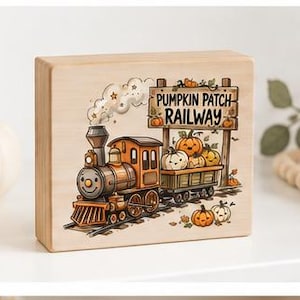 May include: A rectangular wooden block sign featuring a colorful illustration of a steam train pulling a cargo car filled with pumpkins. The sign displays the text PUMPKIN PATCH RAILWAY on a wooden signpost, with additional pumpkins scattered nearby.