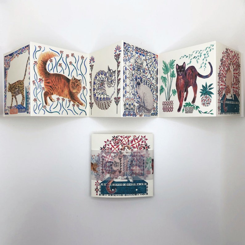 May include: A set of five folded cards featuring colorful illustrations of cats in various poses. The cards are decorated with intricate patterns and floral motifs. The cards are perfect for sending a special message to a cat lover.