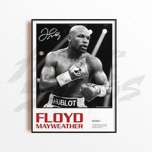 May include: Black and white framed poster featuring boxer Floyd Mayweather. The poster includes Mayweather's signature, the word "FLOYD MAYWEATHER" in red, and the text "MONEY" in white. Mayweather is wearing boxing gloves.