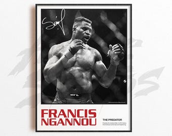May include: Black and white framed poster featuring Francis Ngannou in a fighting stance. The poster includes the name "FRANCIS NGANNOU" in red text, along with the nickname "THE PREDATOR". A signature is visible in the upper left corner.