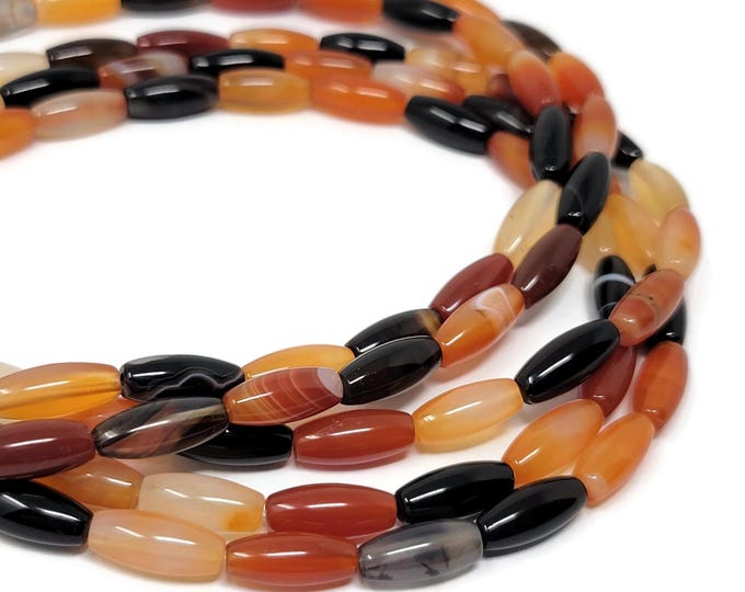 Red and Black Agate rice bead - 31 beads - 12mm by 5mm - rust orange translucent stone oval mix