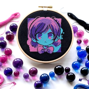May include: A cross-stitch embroidery hoop featuring a colorful anime-style character with blue and purple hues. The embroidery is surrounded by various sizes of glass beads in shades of purple, blue, and black, along with pink embroidery floss.