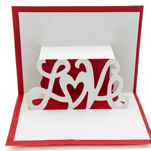 Tarjeta de felicitación romántica en 3D emergente con mensaje "Te amo" para San Valentín, aniversario y día de la madre.