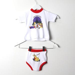 May include: White baby onesie with red trim and a graphic of a campfire scene with the text "Yellowstone Park". Matching white underwear with red trim and a graphic of a moose with the text "Zzzzzz".