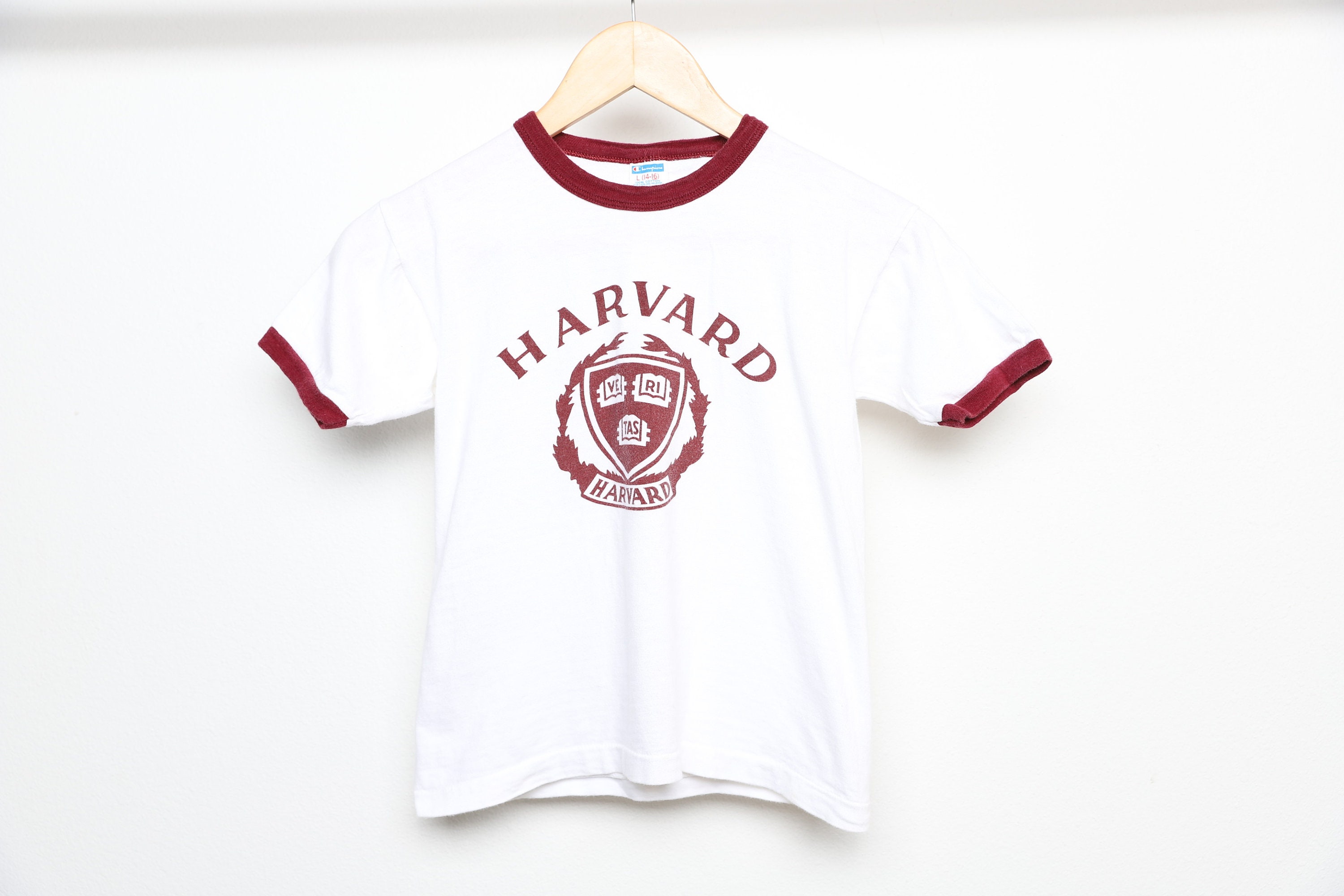 Vintage 1960s 70s CHAMPION Brand HARVARD UNIVERSITY Youth Size Large  women's Extra Small White and Maroon Ringer Champion Brand T Shirt 