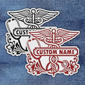 May include: Embroidered patches featuring medical symbols, including a caduceus with wings and a stethoscope. One patch is black and white with the text "CUSTOM", and the other is red and white with the text "CUSTOM NAME". Floral accents surround the designs.
