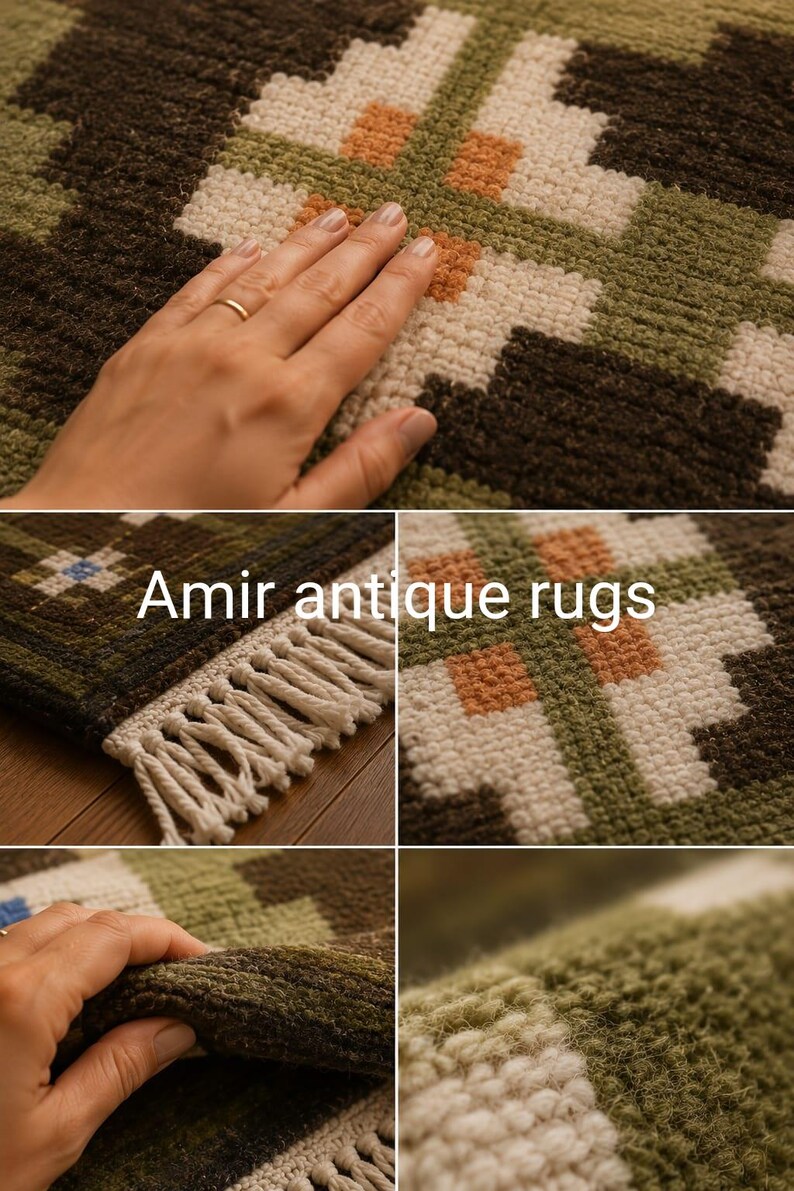 May include: A woven rug featuring a geometric pattern in shades of olive green, dark brown, cream, and orange. The rug has a textured pile and white fringe along the edge. The text Amir antique rugs is visible on the surface of the rug.