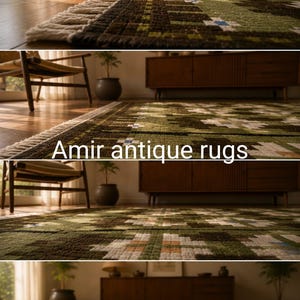 May include: A rectangular area rug featuring a geometric pattern in shades of olive green, dark brown, and white, with white fringe along the edge. The text Amir antique rugs is overlaid on the image. The rug has a textured, woven surface.