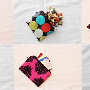 May include: A collection of small zippered pouches with various patterns and designs. The pouches are filled with different items, such as snacks, cards, and coins.