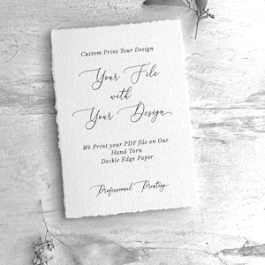 May include: A white, textured paper with deckle edges, featuring elegant calligraphy that reads "Custom Print Your Design" and "Your File with Your Design." The text "We Print your PDF file on Our Hand Torn Deckle Edge Paper" is also visible.