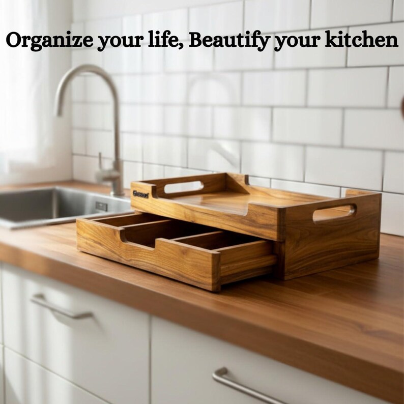 May include: Wooden kitchen organizer with a drawer and compartments. The organizer is made of light brown wood and has a rectangular shape. The text "Organize your life, Beautify your kitchen" is at the top of the image.