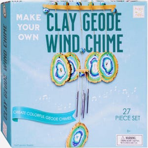 May include: A craft kit for making a clay geode wind chime. The box features the words "Make Your Own Clay Geode Wind Chime" in large teal letters. The wind chime has colorful geode-shaped clay pieces and silver chimes. The kit includes 27 pieces.