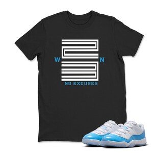 May include: Black t-shirt with a white and blue graphic design that reads "WIN NO EXCUSES". The shirt is paired with a pair of light blue and white trainers.