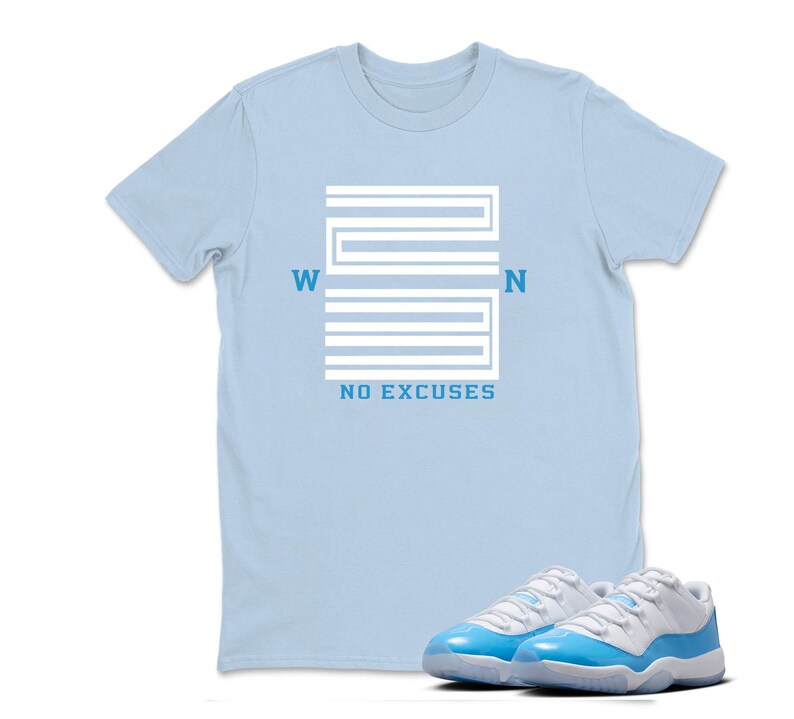 May include: A pale blue t-shirt featuring a white graphic design and the text "WON" and "NO EXCUSES". A pair of light blue and white trainers are in the foreground.