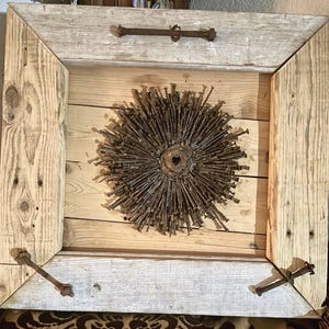 refurbished wood frame with rusty nail art