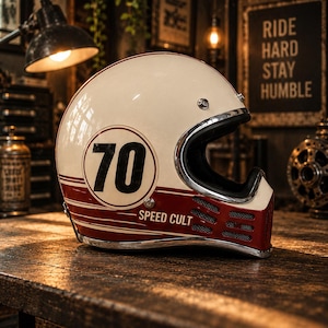 May include: A cream-coloured full-face motorcycle helmet featuring a dark red horizontal stripe, the number 70 in a circular emblem, and the text SPEED CULT printed on the side. The helmet includes a chrome trim and a vented chin guard section.