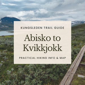 May include: A scenic landscape with a trail guide. The text on the guide reads "Kungsleden Trail Guide Abisko to Kvikkjokk Practical Hiking Info & Map." A person is walking on a wooden path in the distance.