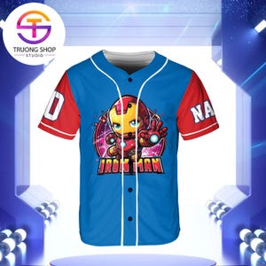 A blue baseball jersey with a graphic of Iron Man on the front, featuring a red sleeve and the text "IRON MAN" printed on the front.