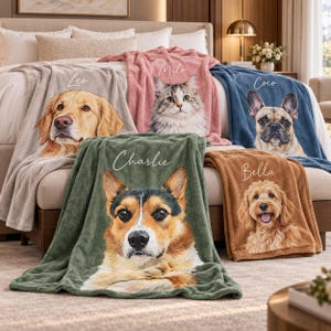 May include: Five soft fleece blankets in beige, pink, blue, olive green, and brown, each featuring a realistic pet portrait and a name printed in white script. The names Leo, Milo, Coco, Charlie, and Bella are displayed above a golden retriever, a cat, a French bulldog, a corgi, and a doodle dog.