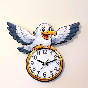 May include: A wall clock featuring a cartoon seagull with white feathers, grey wing tips, and an orange beak. The bird is positioned above a round clock face with a gold-coloured frame, black numbers from 1 to 12, and black hour, minute, and second hands.