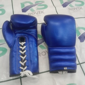 May include: A pair of blue boxing gloves. One glove is laced with white laces, and the other glove is shown from the front. The gloves are made of a shiny material and are designed for boxing or other combat sports.