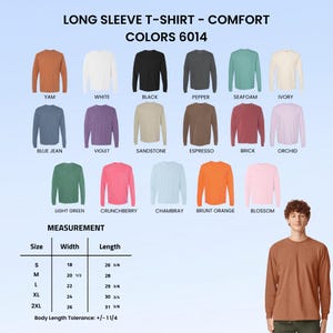 May include: A colour chart for long sleeve t-shirts labelled Comfort Colours 6014, displaying 17 shirt colours including yam, white, black, pepper, seafoam, ivory, blue jean, violet, sandstone, espresso, brick, orchid, light green, crunchberry, chambray, brunt orange, and blossom, with a size measurement table in inches and a person wearing a yam-coloured long sleeve t-shirt.