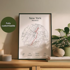 May include: A framed print showing the New York Marathon route map, with a red line marking the course. The print includes the date, distance of 42.2 km, and time. A green circle with the text "Fully customisable" is in the upper left.