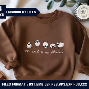 May include: A brown sweatshirt with an embroidered design of five sheep. The phrase "the Lord is my Shepherd" is embroidered below the sheep. The image also includes text indicating embroidery file formats and sizes.