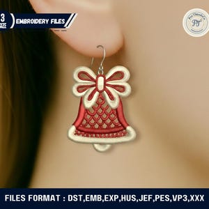 May include: A red and white bell-shaped earring with a bow design. The earring is an embroidery file, with the text "EMBROIDERY FILES" and "3 SIZE" visible. The file formats are DST, EMB, EXP, HUS, JEF, PES, VP3, and XXX.