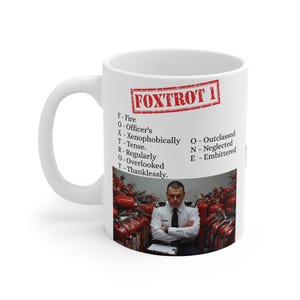 May include: White ceramic mug with the text "FOXTROT 1" in a red stamp-like design. The mug features a list of words starting with each letter of the word "FOXTROT" and an image of a man in a uniform.