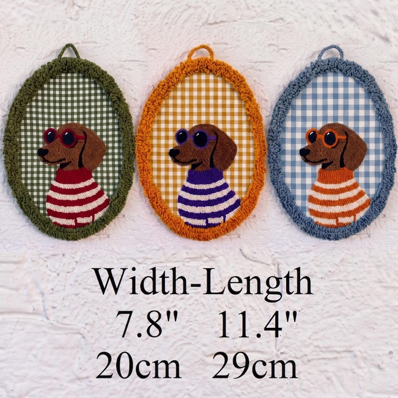 May include: Three oval wall hangings featuring embroidered dachshunds wearing sunglasses and striped sweaters. Each piece has a gingham background and a textured border. The dimensions are 7.8 inches in width and 11.4 inches in length.