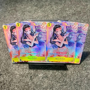 May include: Several trading cards featuring the character Nico Robin from the anime series One Piece. Each card has a colorful design with the number 7 and the number 8000 prominently displayed. The cards are fanned out.