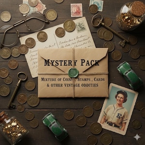 May include: A collection of vintage items, including coins, stamps, and cards, arranged on a dark wooden surface. A brown paper envelope labeled "MYSTERY PACK" is sealed with green wax. Other items include keys, toy cars, and a vintage photograph.