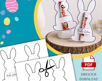 May include: White bunny-shaped Easter decorations holding candy bars, with the text "dupi" and "Kinder" visible. The image also shows printable bunny templates with the text "Frohe Ostern" and scissors. A PDF icon is present with the text "DIREKTER DOWNLOAD NACH DEM KAUF".