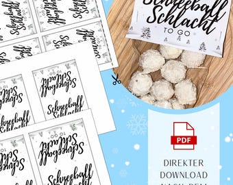 May include: A clear bag filled with white, round treats, labeled "Schneeball Schlacht TO GO." Accompanying are printed labels with the same text and design. A PDF icon with the text "DIREKTER DOWNLOAD NACH DEM KAUF" is also visible.