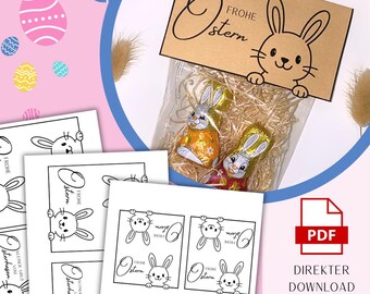 May include: A clear plastic bag filled with wood shavings and two chocolate bunnies wrapped in gold foil, topped with a brown paper tag featuring a black line drawing of a rabbit and the text Frohe Ostern, alongside printable PDF sheets.