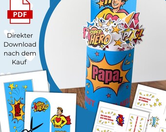 May include: A blue superhero-themed gift box with the word "Papa" in a yellow burst. The box features a superhero illustration and the words "Super Hero". Additional cards and cutouts with star and comic book style graphics are also visible.
