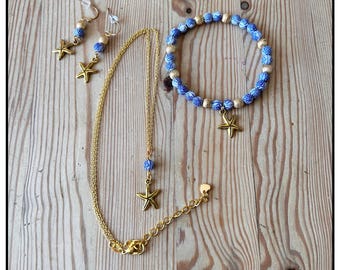 Conjunto de joyas de estrella de mar azul y dorada: collar, pulsera y pendientes