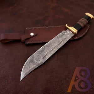 May include: A set of three ceramic mugs with a speckled, matte finish. The mugs are in shades of cream, light gray, and dark gray. Each mug has a simple, minimalist design and a rounded handle.