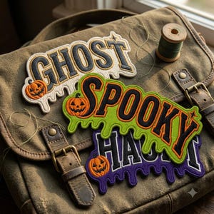 May include: Three embroidered patches with a dripping liquid effect. The top patch is white with black text reading GHOST and an orange pumpkin. The middle patch is lime green with black text reading SPOOKY and an orange pumpkin. The bottom patch is purple with black text reading HAUNT and an orange pumpkin.