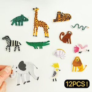 May include: A collection of 12 embroidered animal patches, including a giraffe, zebra, tiger, crocodile, elephant, lion, monkey, and parrot. The patches are colorful and detailed, perfect for decorating clothing or accessories.